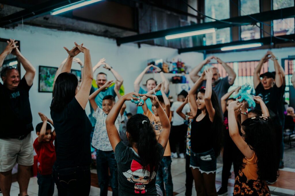 a group of people standing around each other