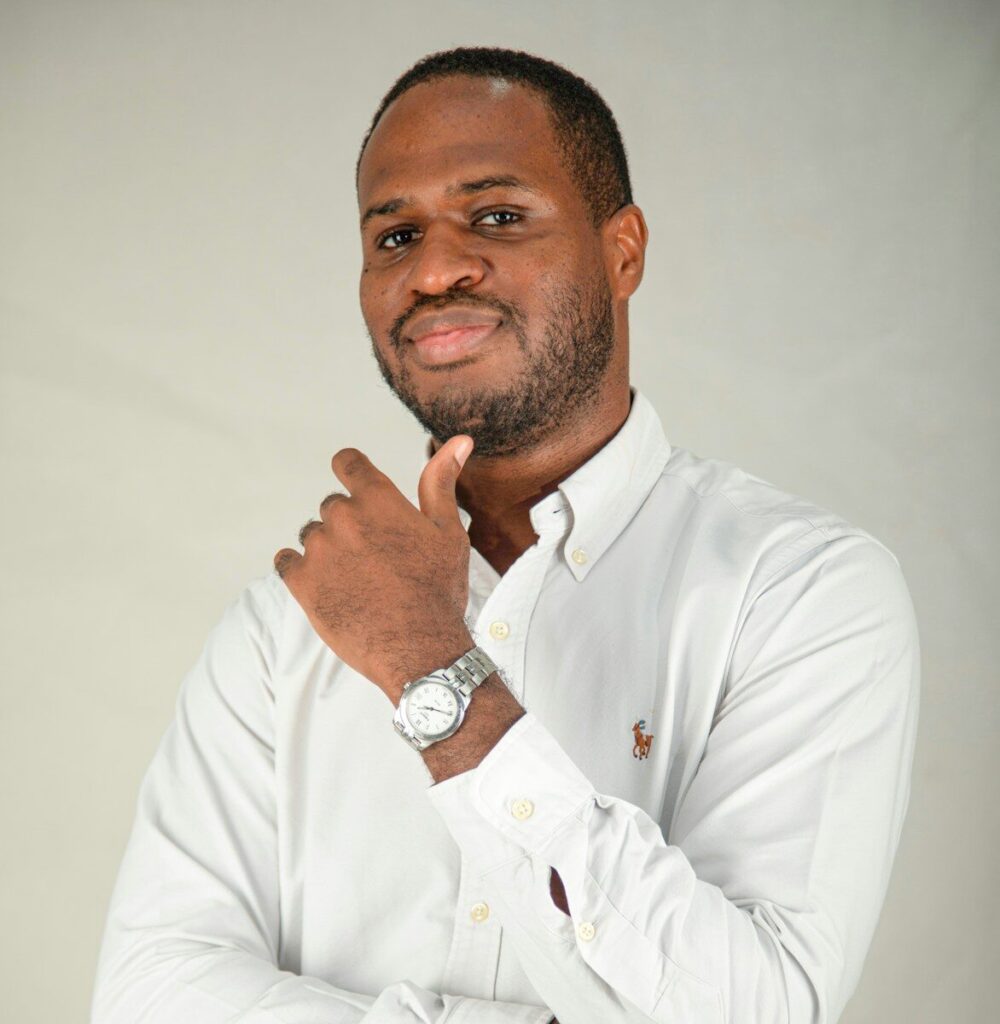 A man in a white shirt with a watch