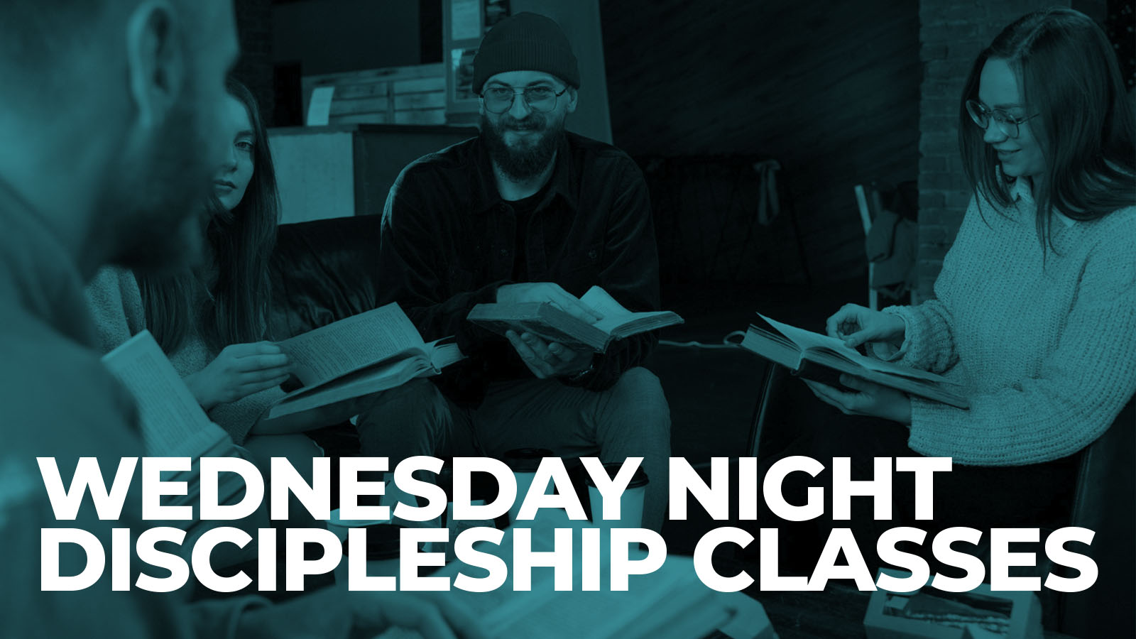 Group reading books at Wednesday night discipleship classes